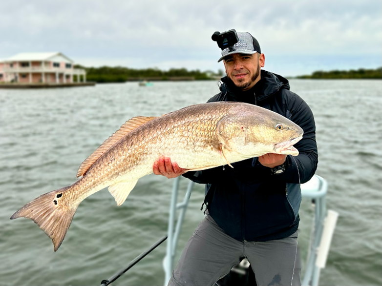 Salt Strong Coach Tony Acevedo holding a fish